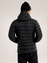 Person wearing a black puffer jacket and beanie on a light gray background - Arc'teryx Cerium Hoody (Men's) - Black