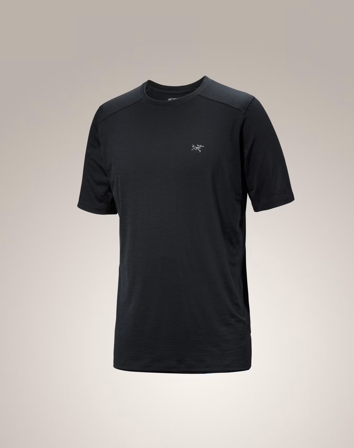 A black short-sleeve athletic t-shirt with a small white Arc'teryx logo on the left chest, displayed on a neutral light gray background. - Arc'teryx Merino Wool Shirt Short Sleeve (Men's) - Black