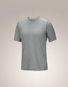 A light gray short-sleeve athletic t-shirt with subtle shoulder panel detailing, shown on a neutral beige gradient background. - Arc'teryx Merino Wool Shirt Short Sleeve (Men's) - Void