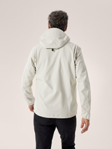 Person wearing a light-colored jacket on a plain background - Arc'teryx Gamma MX Hoody (Men's) - Sea Salt