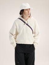 Person wearing a white hoodie with a purple zipper and black pants on a light background - Arc'teryx Mantis 2 Waist Pack - Moondrop