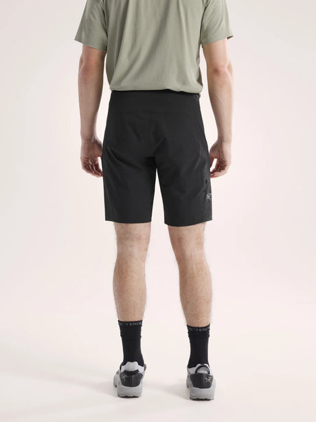 Person wearing black shorts on a light pink background - Arc'teryx Gamma SL Shorts 9" (Men's) - Black