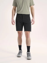 Person wearing black shorts and a green shirt on a light background - Arc'teryx Gamma SL Shorts 9" (Men's) - Black