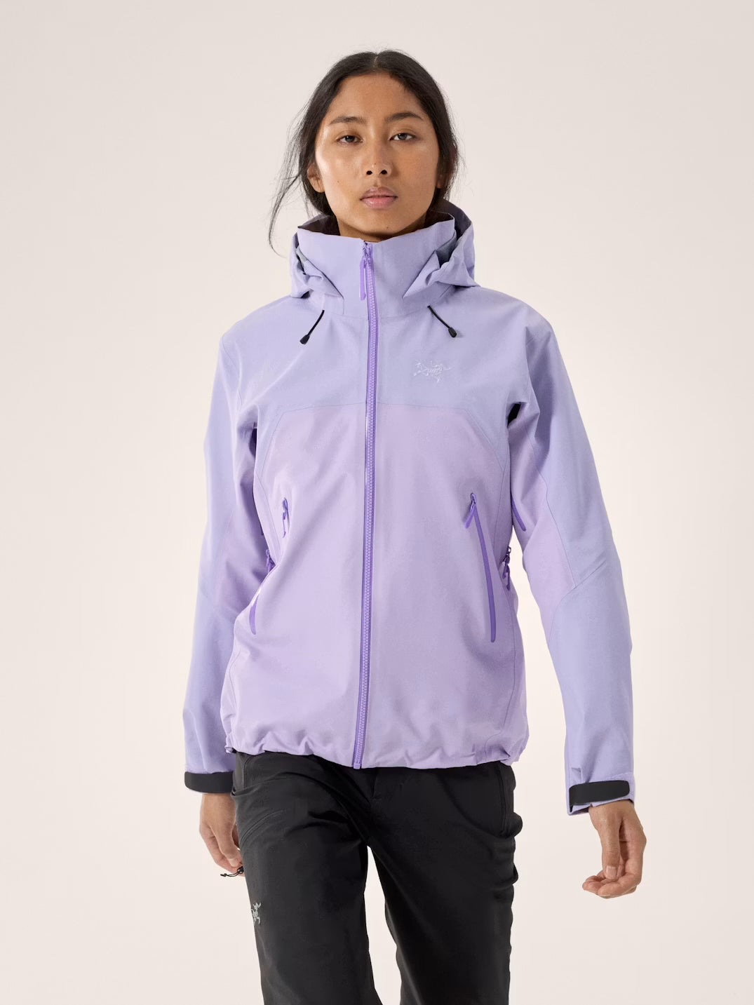 Person wearing a light purple jacket with a hood on a plain background - Arc'teryx Beta AR GORE-TEX Jacket (Women's) - Mallow