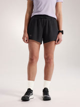 Person wearing black athletic shorts on a plain background - Arc'teryx Norvan Shorts 5" 2-in-1 (Women's) - Black