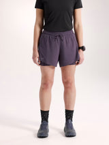 Person wearing purple athletic shorts on a white background - Arc'teryx Norvan Shorts 5" 2-in-1 (Women's) - Moondrop