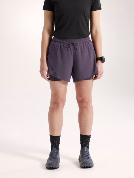 Person wearing purple athletic shorts on a white background - Arc'teryx Norvan Shorts 5" 2-in-1 (Women's) - Moondrop