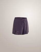 A pair of Arc'teryx running shorts in a muted purple shade, shown against a plain light beige studio background. - Arc'teryx Norvan Shorts 5" 2-in-1 (Women's) - Moondrop