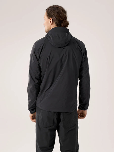 Person wearing a black jacket and pants on a light gray background - Arc'teryx Squamish Hoody (Men's) - Black