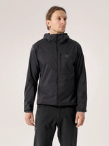 Man wearing a black jacket with a hood on a light gray background - Arc'teryx Squamish Hoody (Men's) - Black