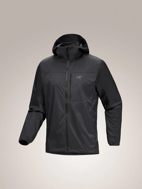 A dark gray hooded jacket with a full zip front and a small Arc'teryx logo on the left chest, displayed against a neutral light gray background. - Arc'teryx Squamish Hoody (Men's) - Black