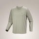A light sage green long-sleeve crewneck shirt with a small Arc'teryx logo on the left chest, displayed on a neutral beige gradient background.  - Arc'teryx Cormac Crew Neck Shirt Long Sleeve (Men's) - Habitat