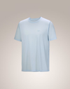 A light blue short-sleeve crewneck t-shirt with a small tonal logo on the left chest, displayed against a neutral beige gradient background. - Arc'teryx Cormac Crew Neck Shirt Short Sleeve (Men's) - Alpine Blue