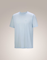 A light blue short-sleeve crewneck t-shirt with a small tonal logo on the left chest, displayed against a neutral beige gradient background. - Arc'teryx Cormac Crew Neck Shirt Short Sleeve (Men's) - Alpine Blue