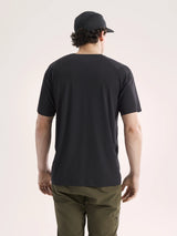 Person wearing a black t-shirt and cap from behind on a light pink background - Arc'teryx Cormac Crew Neck Shirt Short Sleeve (Men's) - Black