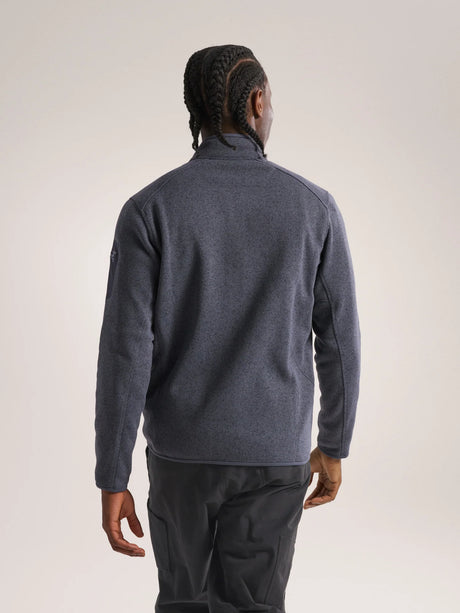Person wearing a gray fleece jacket and pants on a plain background - Arc'teryx Covert Cardigan (Men's) - Dark Stratus Healther/Black Sapphire