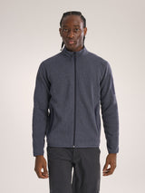 Man wearing a gray fleece jacket on a plain background - Arc'teryx Covert Cardigan (Men's) - Dark Stratus Healther/Black Sapphire