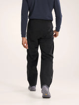 Person wearing black pants and a blue long-sleeve shirt on a white background - Arc'teryx Beta Pants (Men's) - Black