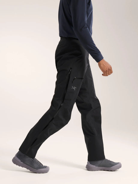 Person wearing black pants and gray shoes on a white background - Arc'teryx Beta Pants (Men's) - Black