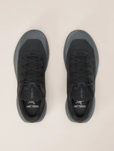 A pair of Arc'teryx low-top sneakers shown from a top-down view on a light beige background. The shoes are primarily black with dark gray accents on the toe and heel areas. - Arc'teryx Norvan LD 4 Shoes (Men's) - Black/Graphite