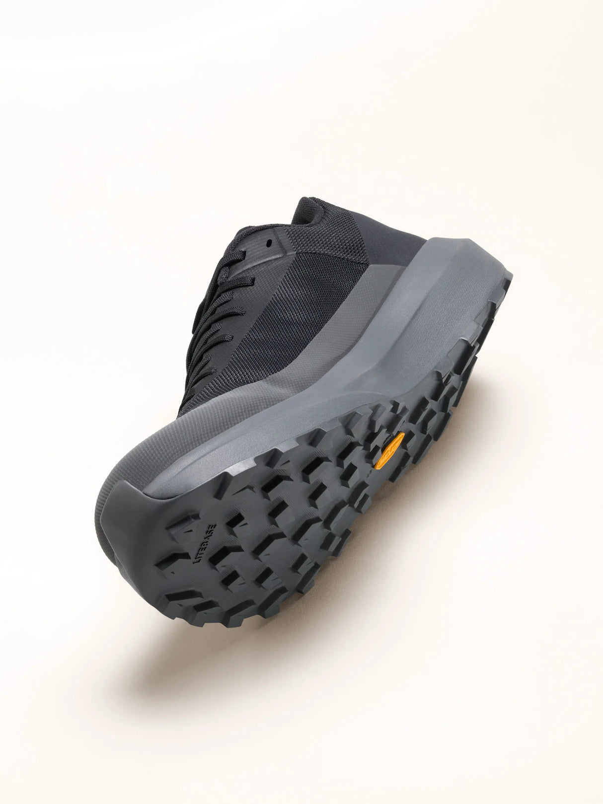 Black boot with a textured sole on a white background - Arc'teryx Norvan LD 4 Shoes (Men's) - Black/Graphite