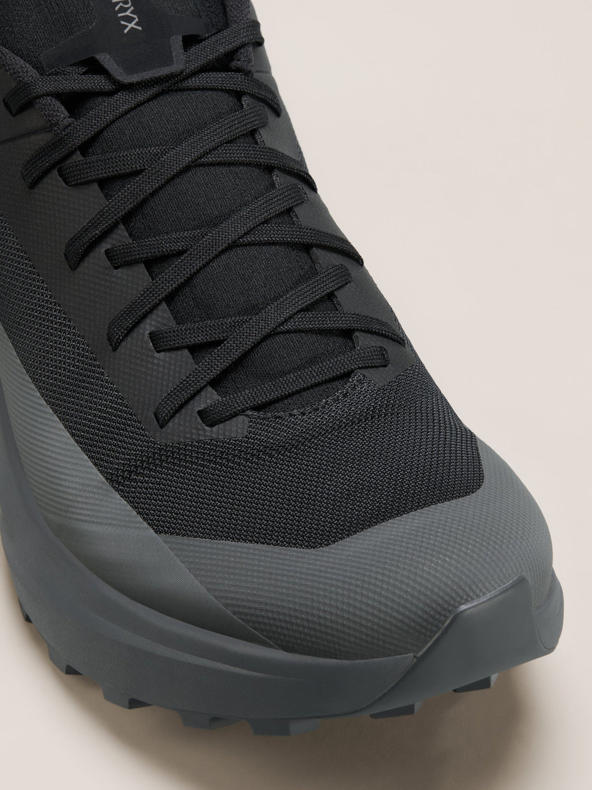 Black and gray sneaker on a light beige background - Arc'teryx Norvan LD 4 Shoes (Women's) - Black/Graphite