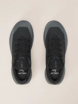 A pair of Arc'teryx low-top sneakers in dark gray and black, shown from a top-down view on a light beige background. - Arc'teryx Norvan LD 4 Shoes (Women's) - Black/Graphite