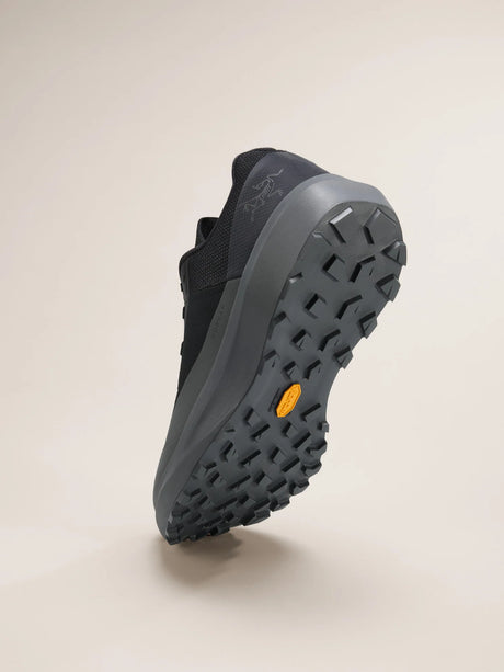 Black athletic shoe with a textured sole on a beige background - Arc'teryx Norvan LD 4 Shoes (Women's) - Black/Graphite