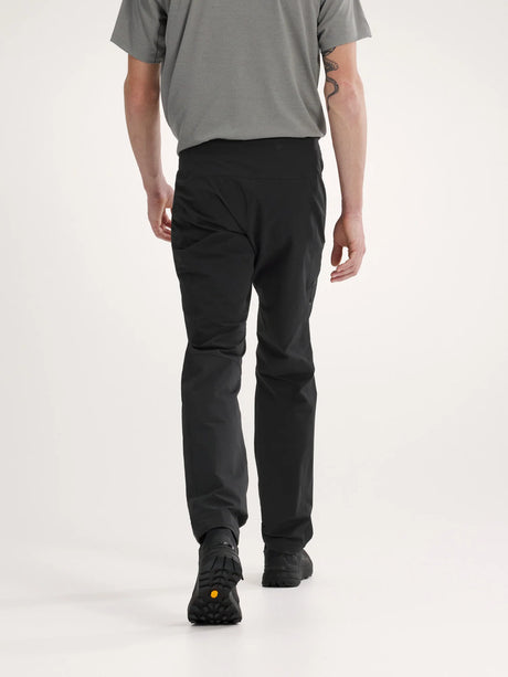 Person wearing black pants and a gray shirt on a white background - Arc'teryx Gamma Pants (Men's) - Black