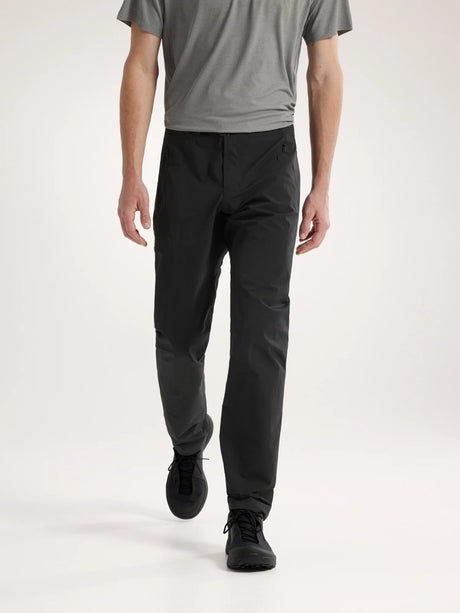Person wearing black pants and a gray shirt on a white background - Arc'teryx Gamma Pants (Men's) - Black