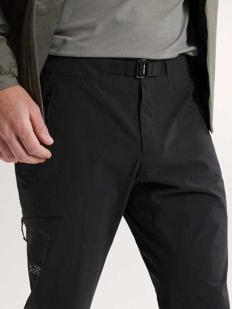 Person wearing black pants with a visible brand logo on a light gray background - Arc'teryx Gamma Pants (Men's) - Black