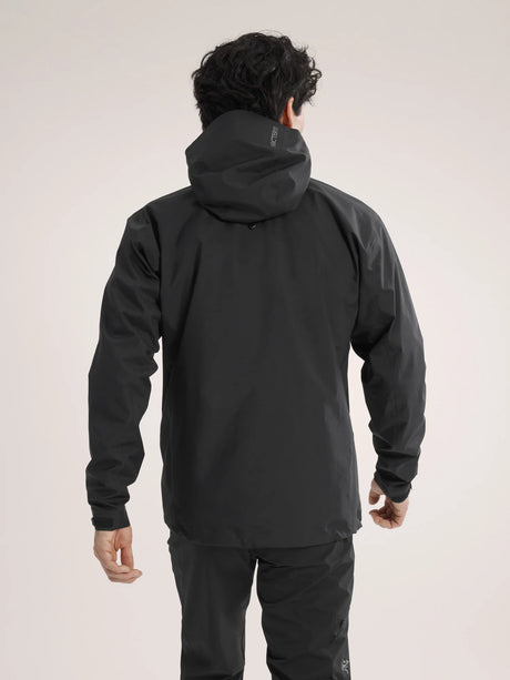 Person wearing a black jacket and pants on a plain background - Arc'teryx Beta Jacket (Men's) - Black