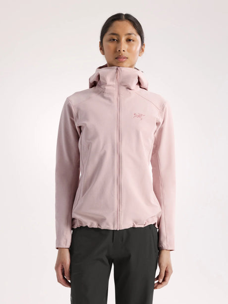 Person wearing a light pink jacket with a brand logo on a white background - Arc'teryx Gamma Hoody (Women's) - Alpine Rose