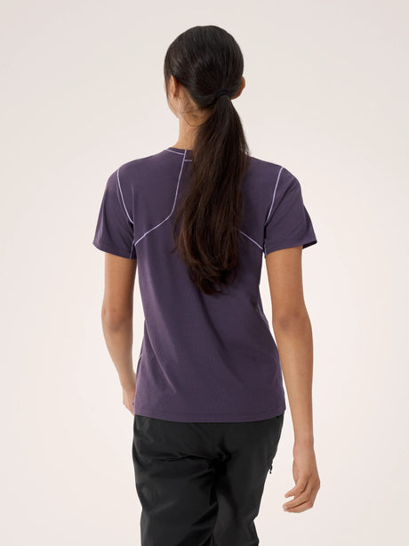 Person wearing a purple athletic shirt with white accents on a plain background - Arc'teryx Sunna Crew Shirt Short Sleeve (Women's) - Moondrop