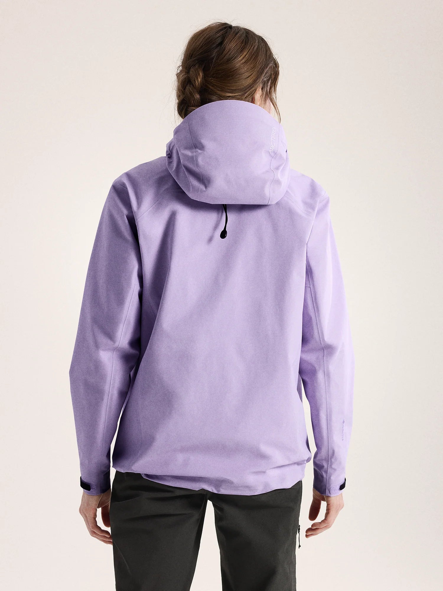 Person wearing a light purple jacket on a plain background - Arc'teryx Beta Jacket (Women's) - Mallow