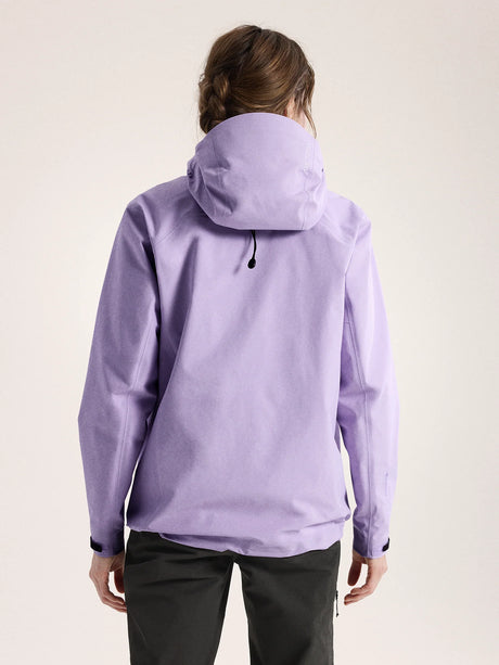 Person wearing a light purple jacket on a plain background - Arc'teryx Beta Jacket (Women's) - Mallow