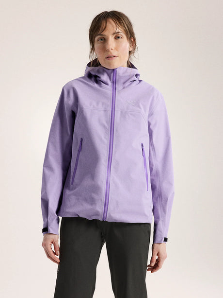 Woman wearing a light purple jacket with a hood on a plain background - Arc'teryx Beta Jacket (Women's) - Mallow