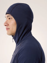 Person wearing a navy blue hooded jacket on a light background - Arc'teryx Delta Hoody (Men's) - Black Sapphire