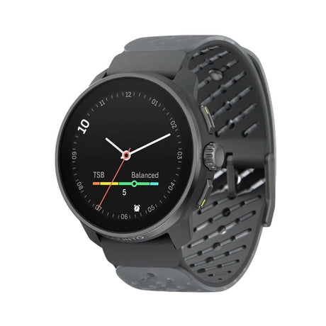 A dark gray smartwatch with a round black face and a perforated dark gray silicone strap, shown at an angle on a plain white background. - Suunto Race S Titanium GPS Sports Watch - Graphite