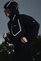 Person wearing a black jacket with reflective white accents running outdoors. - Salomon Bonatti Pro Jacket (Men's) - Deep Black