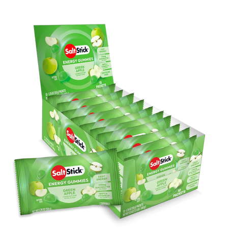 A retail display box of SaltsStick Energy Gummies in Green Apple flavor, with multiple individual packet packs arranged in front on a clean white background. - SaltStick Energy Gummies - Green Apple - 10 Pack