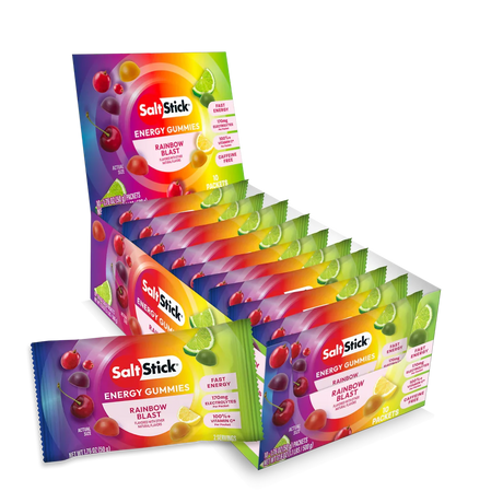 A retail display box and individual packets of SaltsStick Energy Gummies Rainbow Blast flavor, showing colorful packaging with illustrations of cherries, lime, and grapefruit on a white background. - SaltStick Energy Gummies - OMG! Rainbow Blast - 10 Pack