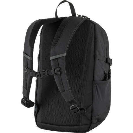 A black backpack shown from the back view, featuring padded shoulder straps, a breathable mesh back panel, side pockets, and adjustable buckle straps, set against a plain white background. - Fjällräven Skule 20 Backpack - Black