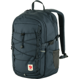 A Fjälleväl backpack in dark navy blue, featuring multiple zippered compartments, a front webbing strap system, and a side pocket, shown against a plain white background. - Fjällräven Skule 20 Backpack - Navy