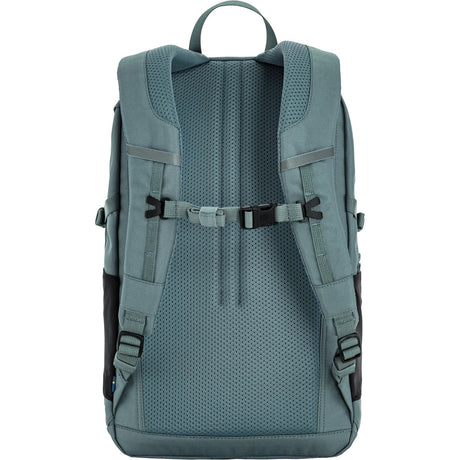 Back view of a teal backpack with straps on a white background - Fjällräven Skule 20 Backpack - Nimbus Blue