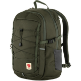 Fjälleväl outdoor backpack in olive green with a dark gray side pocket, front compression straps, and a Fjälleväl logo patch on the lower front, shown on a plain white background. - Fjällräven Skule 20 Backpack - Deep Forest
