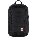 Black backpack with a visible brand logo on a transparent background - Fjällräven Skule 28 Backpack - Black