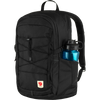 A black Fjälör backpack with a side water bottle pocket containing a blue water bottle, shown against a plain white background. - Fjällräven Skule 28 Backpack - Black