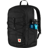 A black Fjälör backpack with a side water bottle pocket containing a blue water bottle, shown against a plain white background. - Fjällräven Skule 28 Backpack - Black