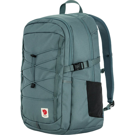 Teal backpack with a visible brand logo on a white background - Fjällräven Skule 28 Backpack - Nimbus Blue
